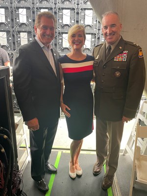 Welcome_Home_Ceremony_Co-Hosts_Joe_Theismann_and_Sharlene_Wells_Hawkes_stand_next_to_VWC_Director_U.S._Army_Maj._Gen._Edward_J._Chrystal,_Jr.
